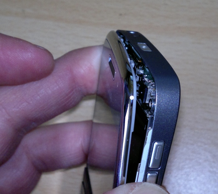 Gently prising the two parts apart