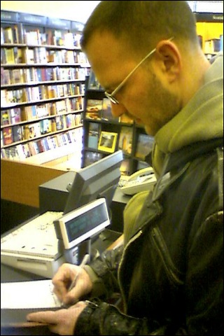 Cory Doctorow signing his Books